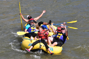 People having fun on raft in the river