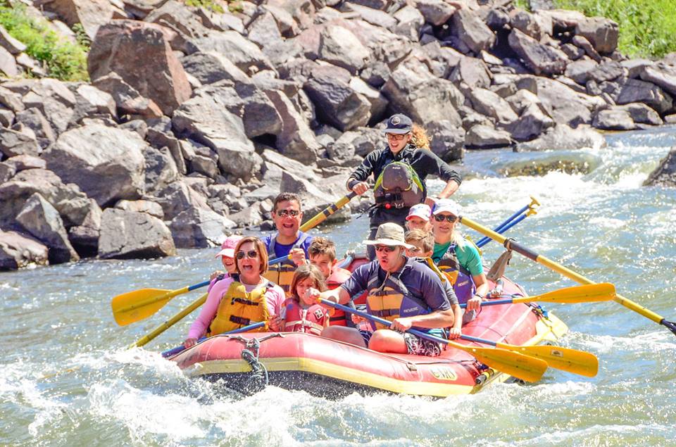 Family smiling on rafting trip