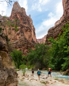 people in the wading colorado river