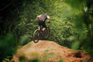 mountain biker going over jump